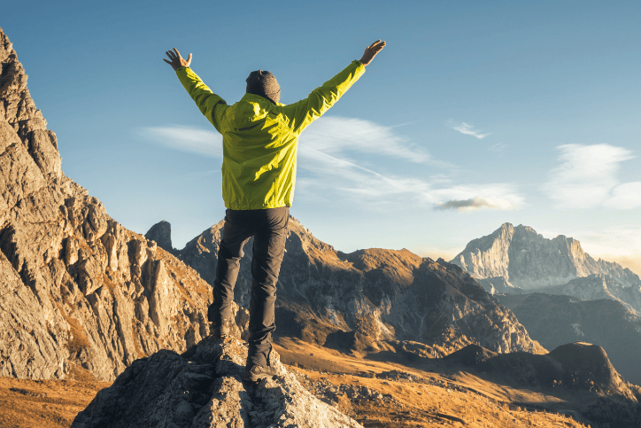 man overlooking mountain landscape