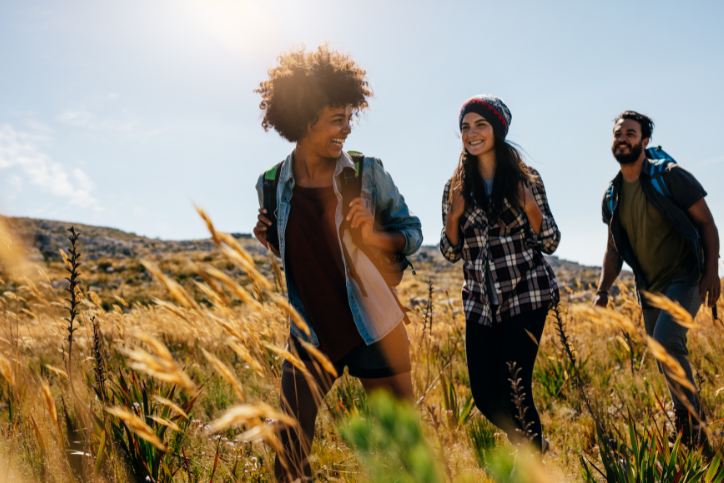 friends walking through fields together